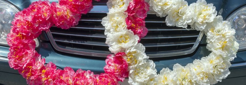 Weddings On The Car With Their Hands